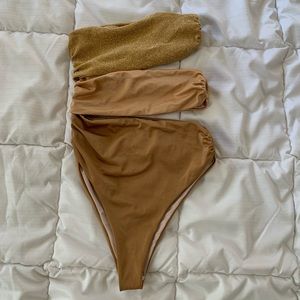 Baobab one piece gold glitter swimsuit with a skirt coverup